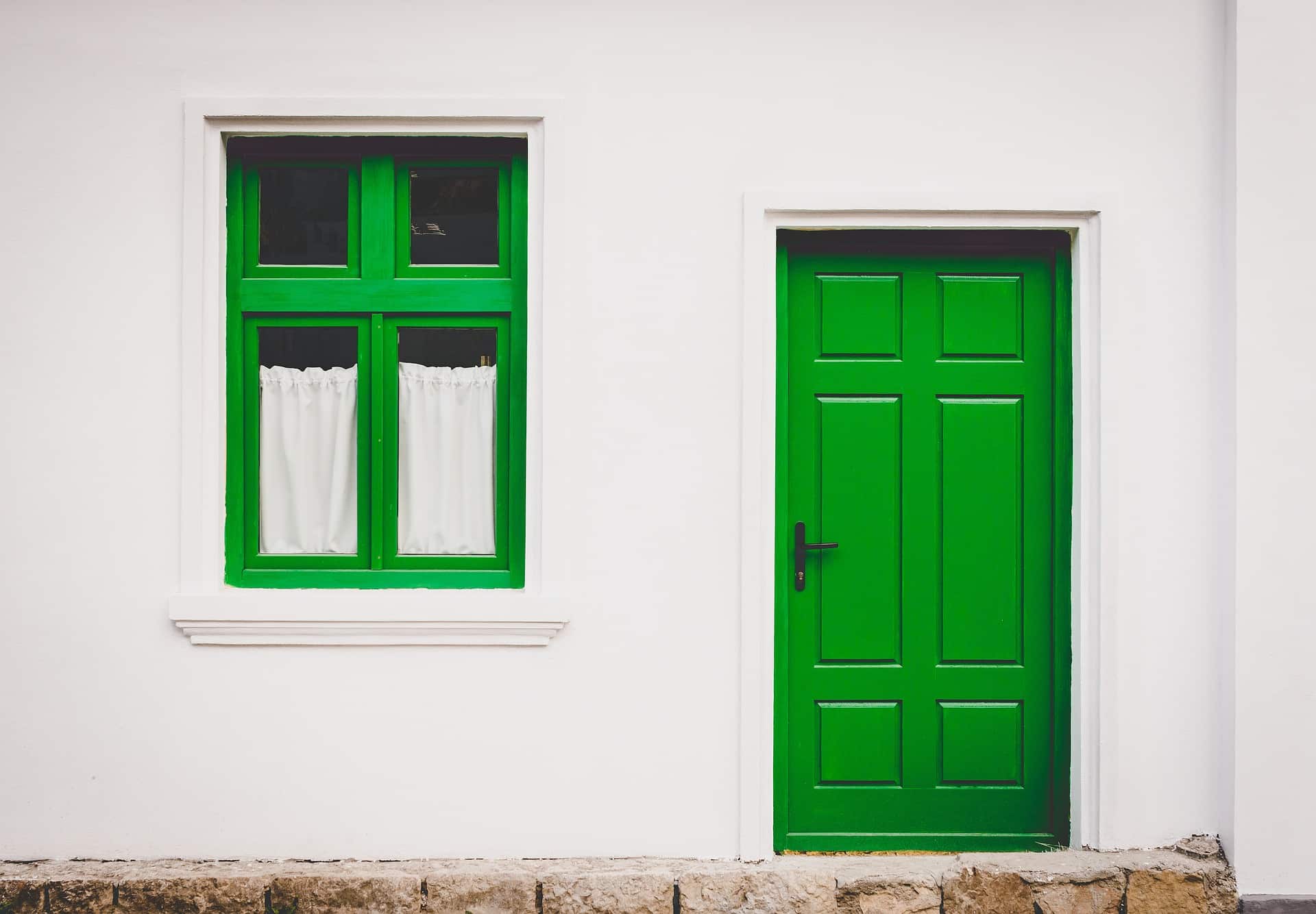 A lime green front door and a lime green window.